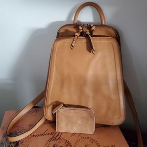 Tan leather backpack and wallet